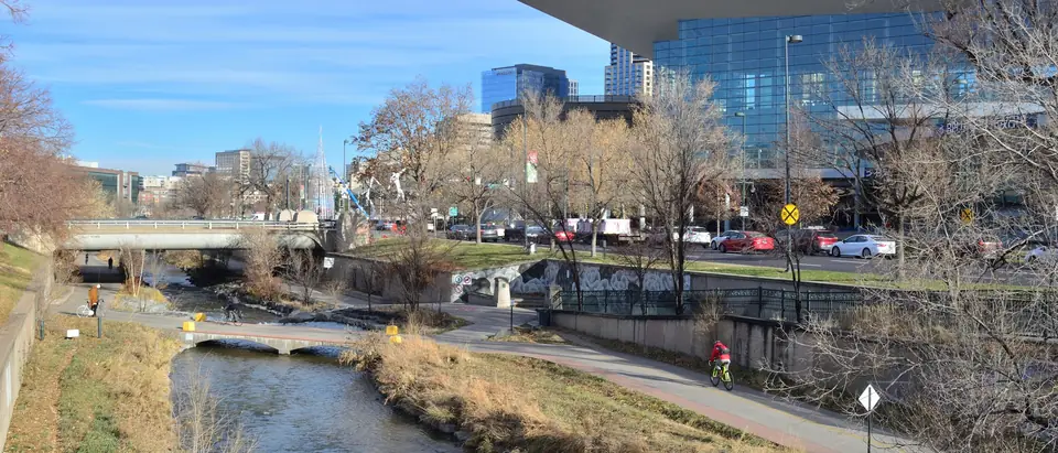 The Cherry Creek Trail running beside the creek in Denver on a clear day